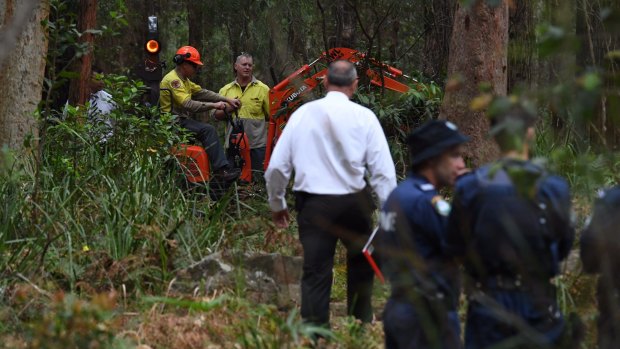 An excavator helps in the search for Matthew Leveson's body in the Royal National Park on Friday.