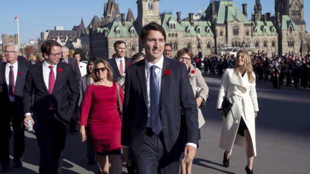 Prime Minister Justin Trudeau and his newly sworn-in cabinet ministers arrive on Parliament Hill in Ottawa on Wednesday.