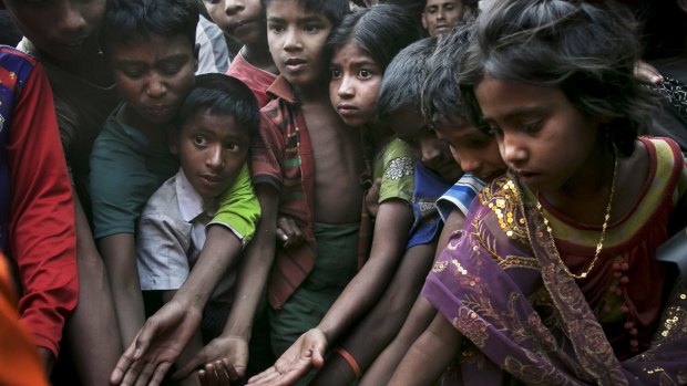 Rohingya refugees ask for food at the Leda Rohingya refugee camp in Chittagong, Bangladesh.