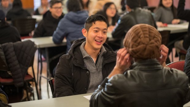 Brandon Hung makes the most of his four minutes at a Melbourne University speed friending event.
