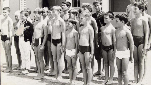 Peter O'Brien, third from left in black jacket, and Greg Mason, seventh from left, were members of the inaugural Bondi Life Boys.