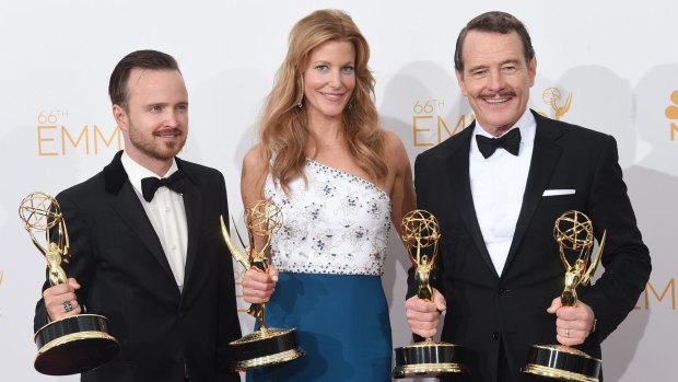Breaking good: Aaron Paul, Anna Gunn and Bryan Cranston with their Emmy haul for Breaking Bad.
