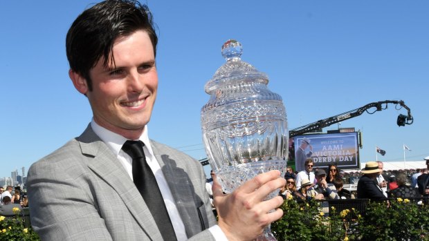 Godolphin trainer: James Cummings with the Victoria Derby trophy