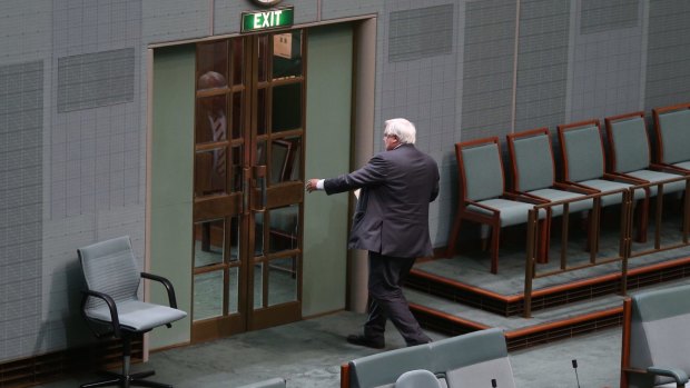 Clive Palmer leaves the House of Representatives chamber.