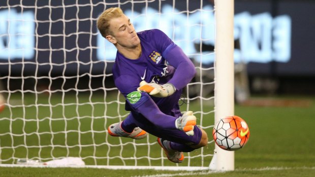 Saved: Manchester City keeper Joe Hart stops the decisive shot during the penalty shoot-out.