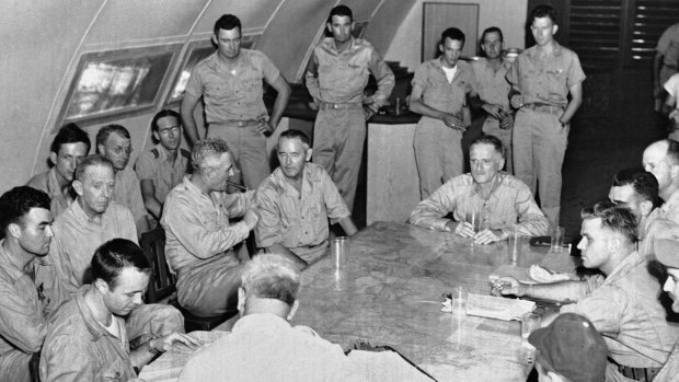 The crew of the Enola Gay is debriefed after returning from their atomic bombing mission over Hiroshima.