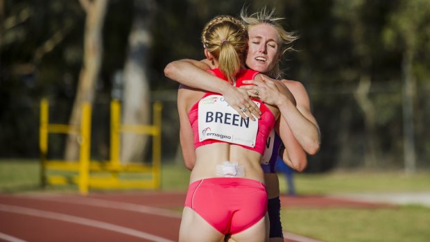 Melissa Breen and Sally Pearson after the 100m race at the AIS on Saturday.
