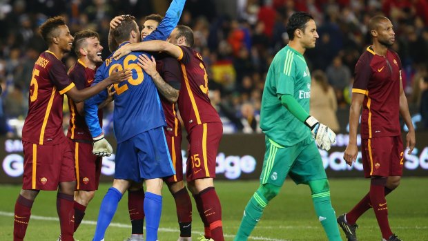 Grinners: AS Roma Players celebrate after winning the penalty shootout to decide the match.