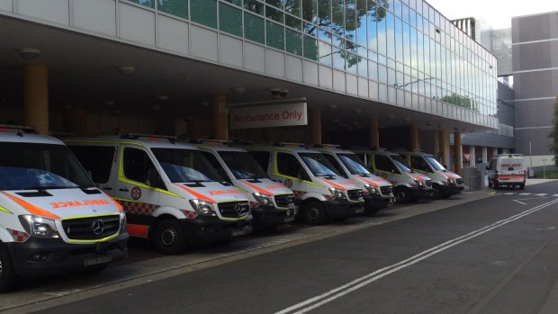 Ambulances outside Liverpool Hospital on Monday while the system was swamped with emergency calls.