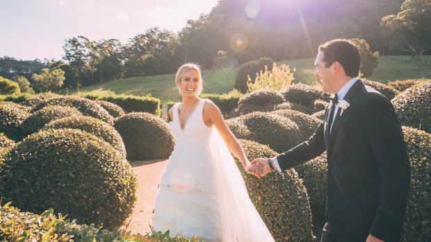 Jeffreys stunned in a tiered, Rebecca Vallance gown with train.