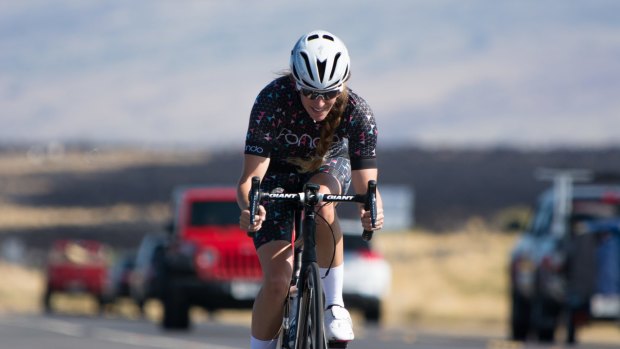 A woman on the road in Fondo cycling gear.