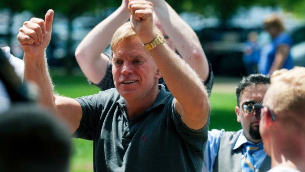 Former Louisiana state representative David Duke arrives to give remarks after a white nationalist protest was declared an unlawful assembly.