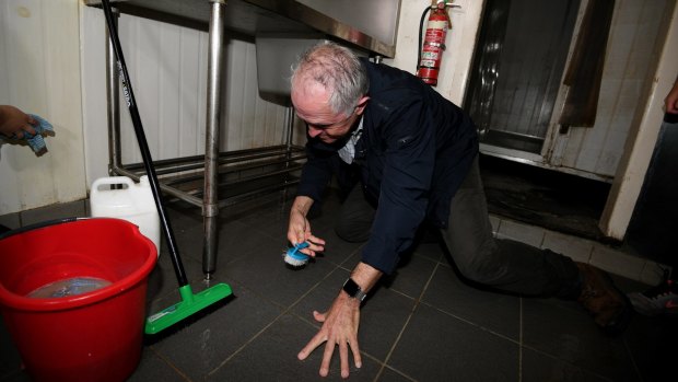 Prime Minister Malcolm Turnbull gets his hands dirty in Lismore, but will there be real government help once the cameras go away?