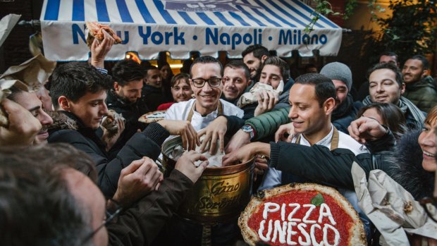 Sorbillo hands out free pizzas to celebrate UNESCO's recognition of the art of Neapolitan pizza making.