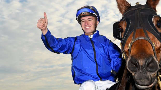 The Canberra-owned Happy Clapper is racing for second behind Winx in the Cox Plate.
