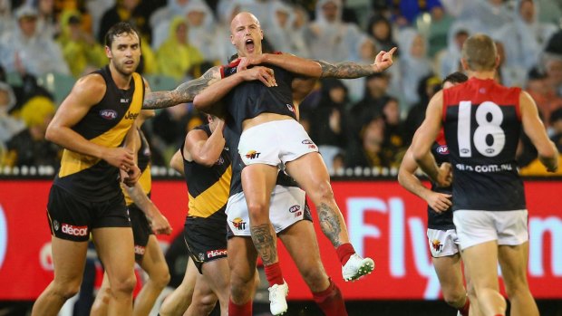 Team-lifter: Melbourne skipper Nathan Jones celebrates after kicking a vital third-quarter goal.