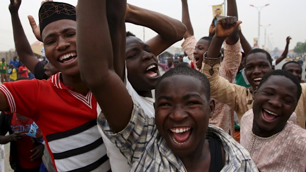 Supporters of Muhammadu Buhari and his All Progressive Congress celebrate the election win in Kano.