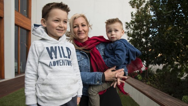 Nikola Barac, 6, with his mother Fiona Stamenkovic and brother Milan outside Westmead Institute for Medical Research. 