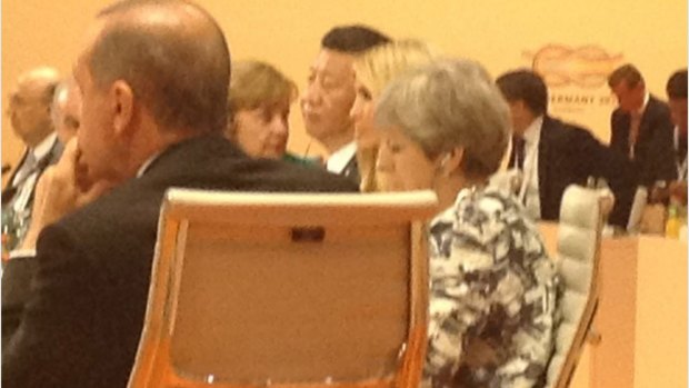 Ivanka Trump, in her father's seat, between China's Presdient Xi Jinping and Britain's Theresa May.