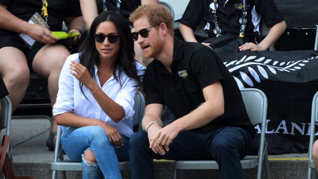 Prince Harry and his girlfriend Meghan Markle attend a wheelchair tennis event at the Invictus Games in Toronto, Monday, Sept. 25, 2017.