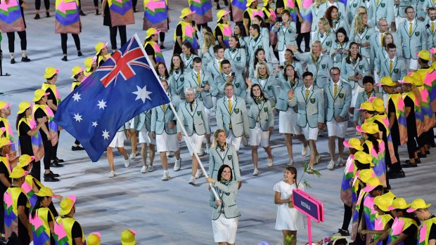 Happier times: Anna Meares leads Australia into the opening ceremony.
