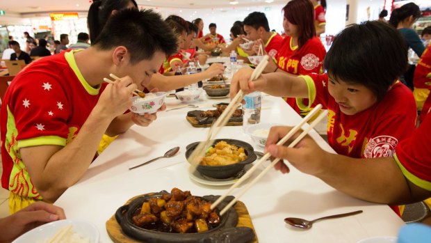 Time to feed the Yau Kung Mun martial arts club, which has operated in Sydney for 35 years. The club's lion dance troupe will perform at over 80 events during this Chinese New Year.