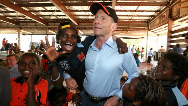 Prime Minister Tony Abbott with excited school children at Yirrkala School during his visit to North East Arnhem Land in September last year.