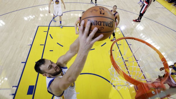 Cruising to victory: Andrew Bogut dunks during the win.
