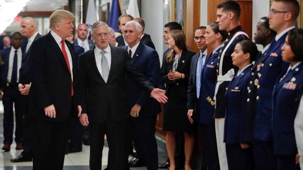 President Donald Trump and Vice-President Mike Pence with Defence Secretary Jim Mattis, centre, greet military personnel during their visit to the Pentagon last month.