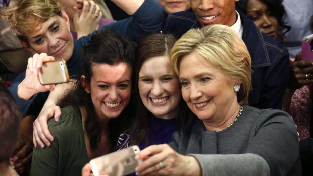 Democratic presidential candidate Hillary Clinton takes photos with supporters after speaking at a campaign rally in Norfolk, Virginia, on Monday.
