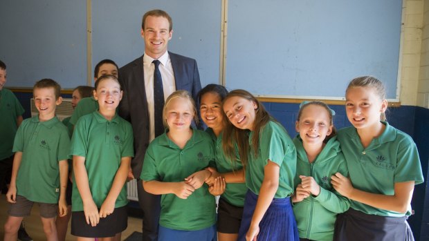 Former Brumbies and Wallabies player Pat McCabe with students of Kaleen Primary School at the Say No to Racism Program. 