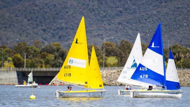 John Garbutt, Stewart Cathie and Colin Alderton take part in the Sailability ACT Friendship Cup on Lake Tuggeranong.