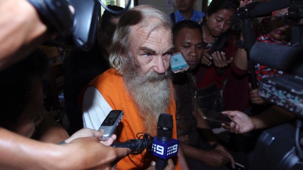 Accused Australian paedophile Robert Andrew Fiddes Ellis talks to reporters in a courtroom in Bali on Tuesday.