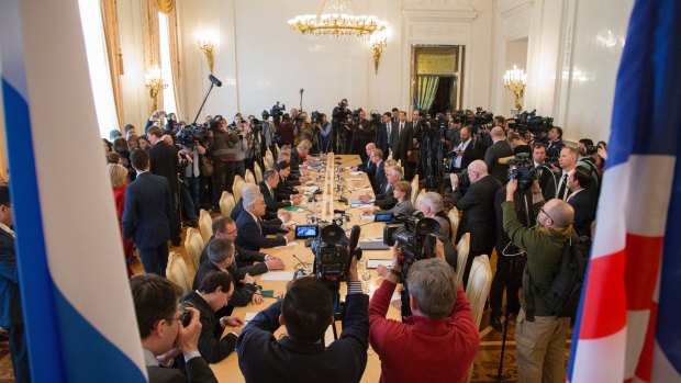 Media surround a table as US Secretary of State Rex Tillerson and Russian Foreign Minister Sergey Lavrov talk in Moscow, Russia, on Wednesday.