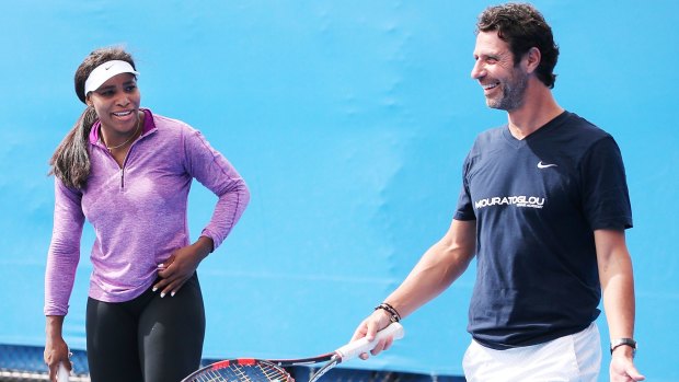 Serena Williams talks to her coach Patrick Mouratoglou during a practice session at Melbourne Park on Saturday.