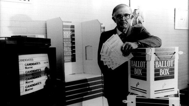 Colin Hughes, the electoral commissioner, publicises then new voting screens and ballot boxes in the 1980s.