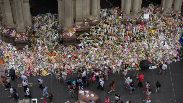 The makeshift floral memorial that appeared on Bourke Street for the victims of the attack.