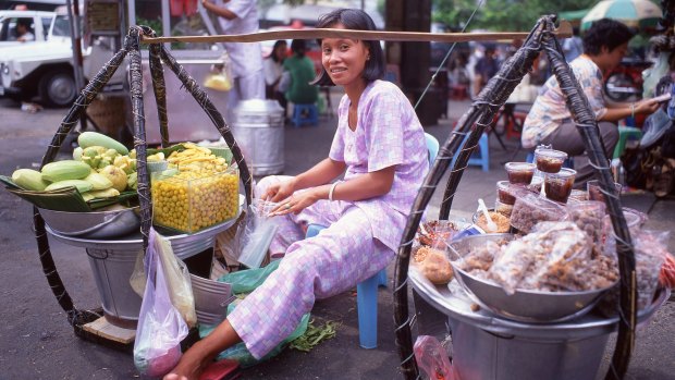 A fruitseller at  Binh Tay Market in   Ho Chi Minh City.