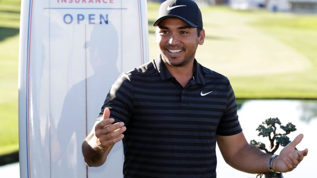 Jason Day enjoys the moment after victory in the  Farmers Insurance Open.