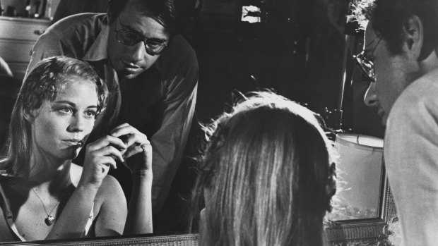 Director Peter Bogdanovich speaks with Cybill Shepherd on the set of the 1971 film 