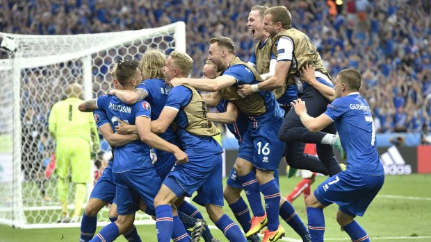 England await: Iceland players celebrate going through after defeating Austria.