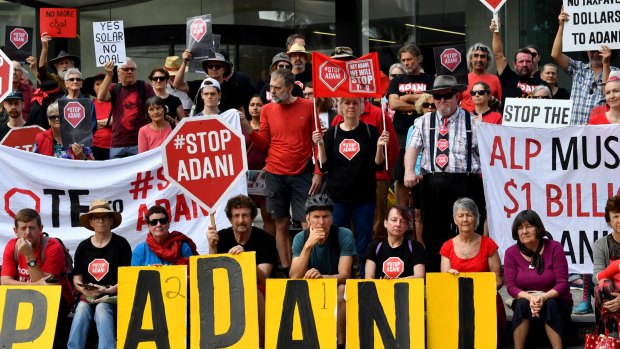 Protestors against the Adani coal mine rally outside Adani's headquarters in Brisbane.