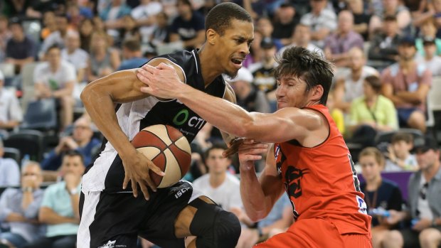 Stephen Dennis is fouled by Damian Martin.
