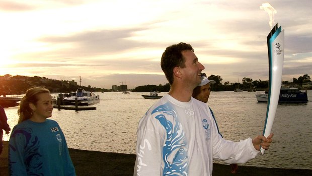 Seoul Olympic gold medalist Duncan Armstrong at the Brisbane River during the Sydney 2000 torch relay.