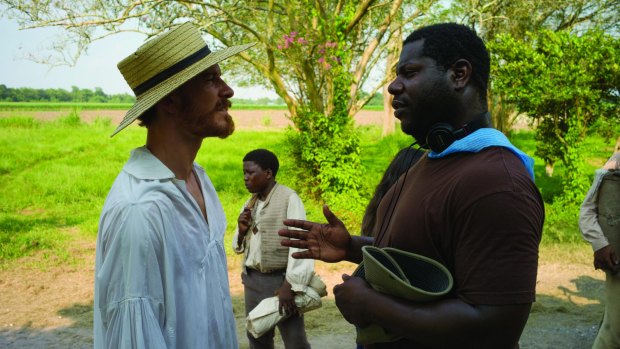 Michael Fassbender and director Steve McQueen on the set of <i>12 Years A Slave.</i>