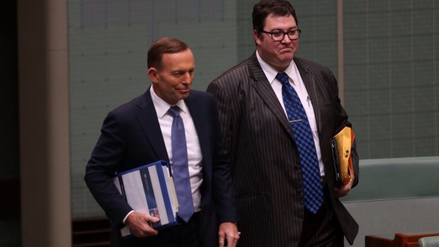 Then prime minister Tony Abbott arrives for question time with George Christensen in 2014.