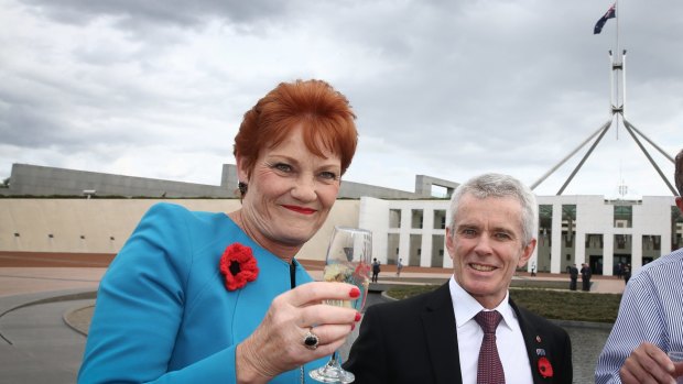 Senator Pauline Hanson with Senator Malcolm Roberts at Parliament House.