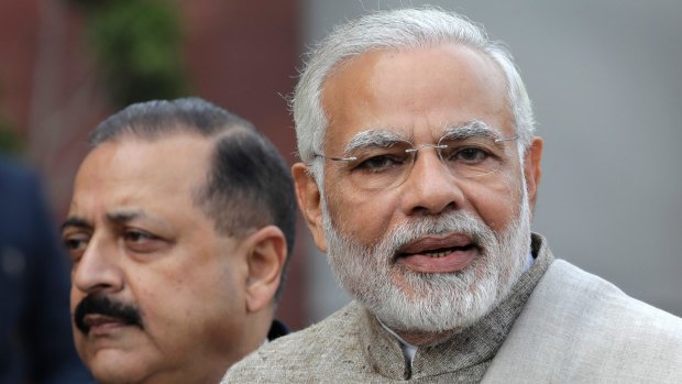 Indian Prime Minister Narendra Modi, right, has pledged trillions of rupees to upgrade infrastructure and bolster state-run banks' finances in an effort to stoke private spending.