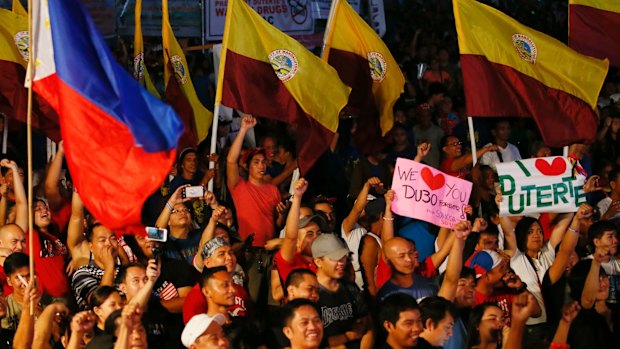 Hundreds of supporters of President Duterte gather at Manila's Rizal Park last month.