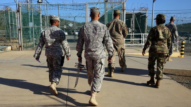 Military guards leave Camp Delta at the Guantanamo Bay detention centre earlier this month.